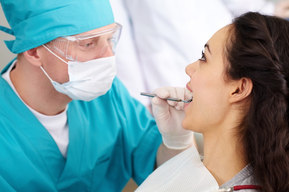 dentist doing oral cance screening