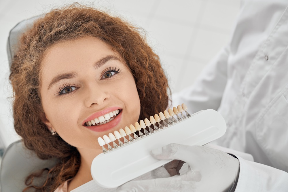 woman replacing dental veneers
