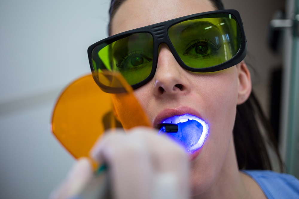 dentist doing zoom teeth whitening